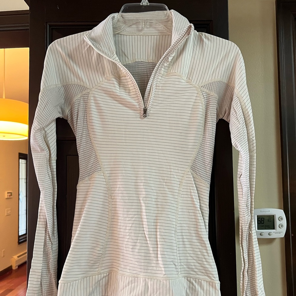 Lululemon grey and white quarter zip, small hole on the sleeve